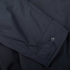 A close up of a Navy Blue Nylon Padded Aspesi Field Jacket with buttons.