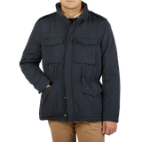 A man wearing an Aspesi Navy Blue Nylon Padded Field Jacket.