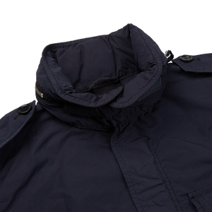 The back of an Aspesi Navy Blue Nylon Taffeta M65 Field Jacket in waterproof fabric.