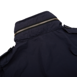 The Aspesi navy blue nylon taffeta M65 field jacket features zippers, perfect for outdoor activities in rain.