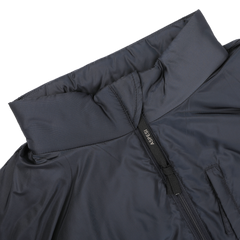 Close-up of the Navy Blue Nylon Taffeta Thermore Jil Gilet featuring a high collar and zipper. The Aspesi brand name is visible on the zipper pull, highlighting its Thermore insulation for enhanced warmth.