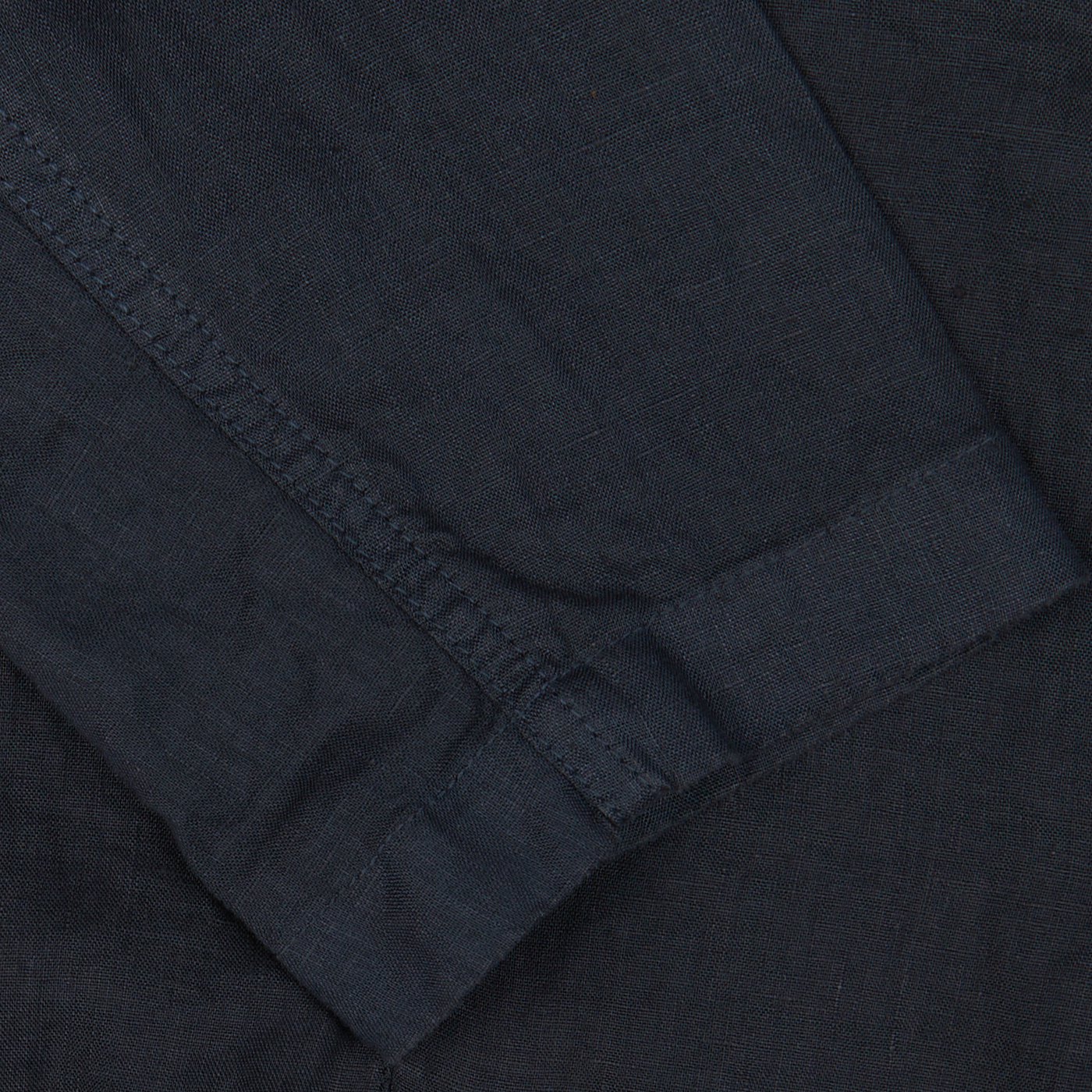 Close-up of Navy Blue Washed Linen Samuraki Jacket fabric with visible seam and stitching detail by Aspesi.