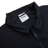 The back of a Navy Cotton Canvas Windbreaker Stringa jacket by Aspesi with a zipper.