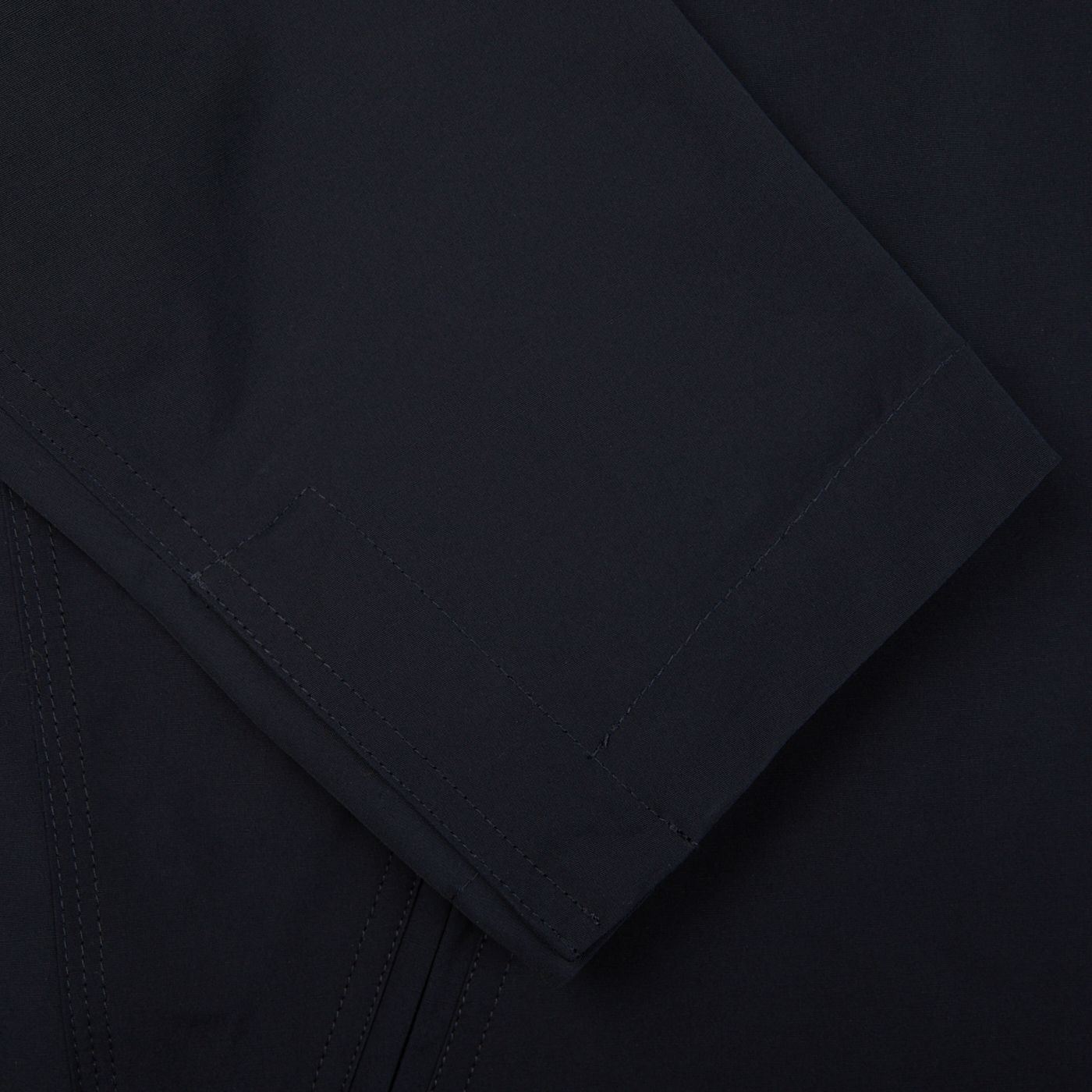 A close up of the pocket of a Navy Cotton Canvas Windbreaker Stringa Jacket by Aspesi.