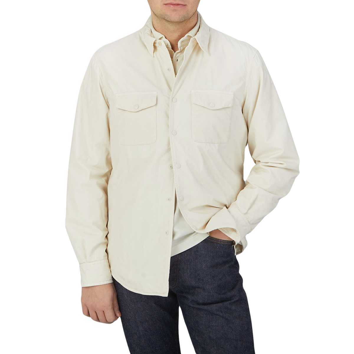 A man wearing an Off-White Cotton Padded Overshirt and jeans by Aspesi.