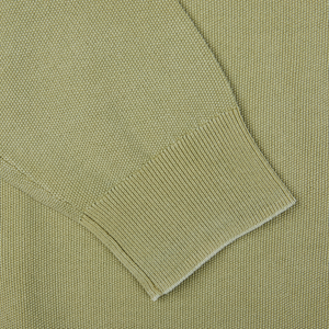 A close up of a Aspesi sage green, crew neck sweater.