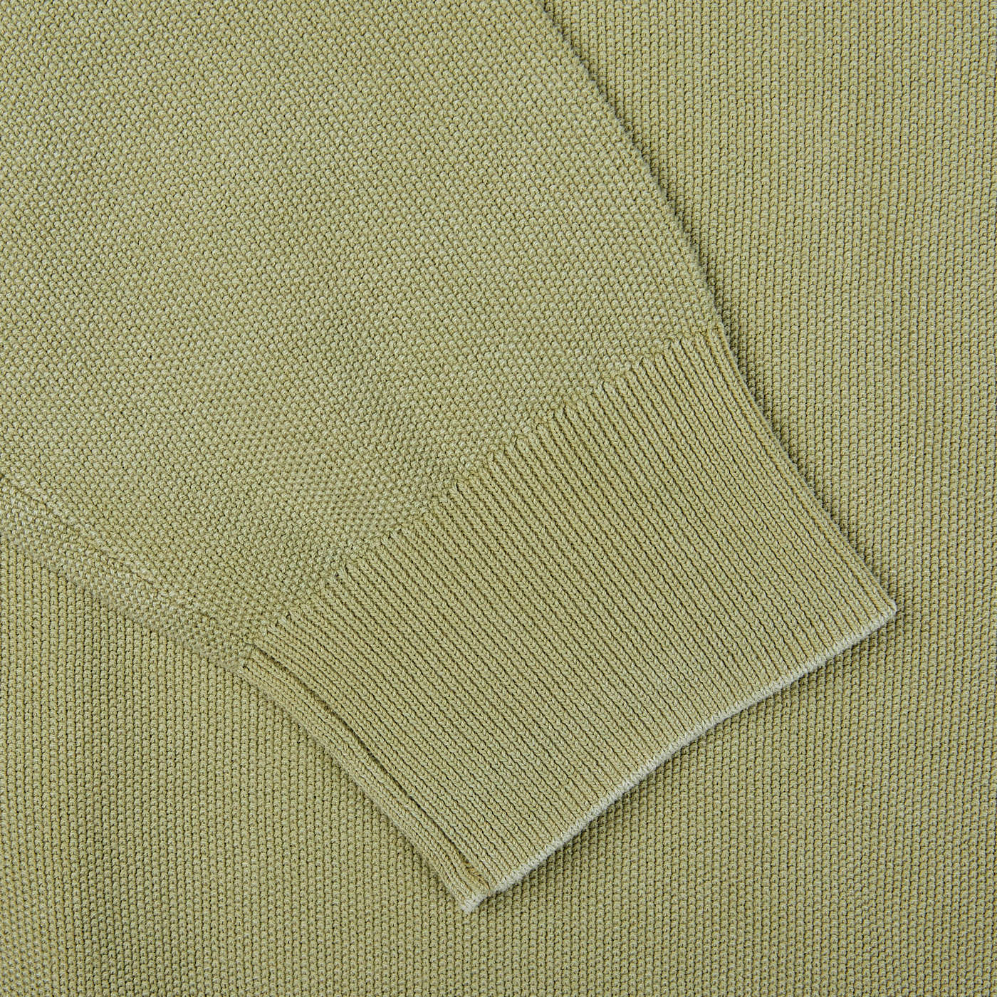 A close up of a Aspesi sage green, crew neck sweater.