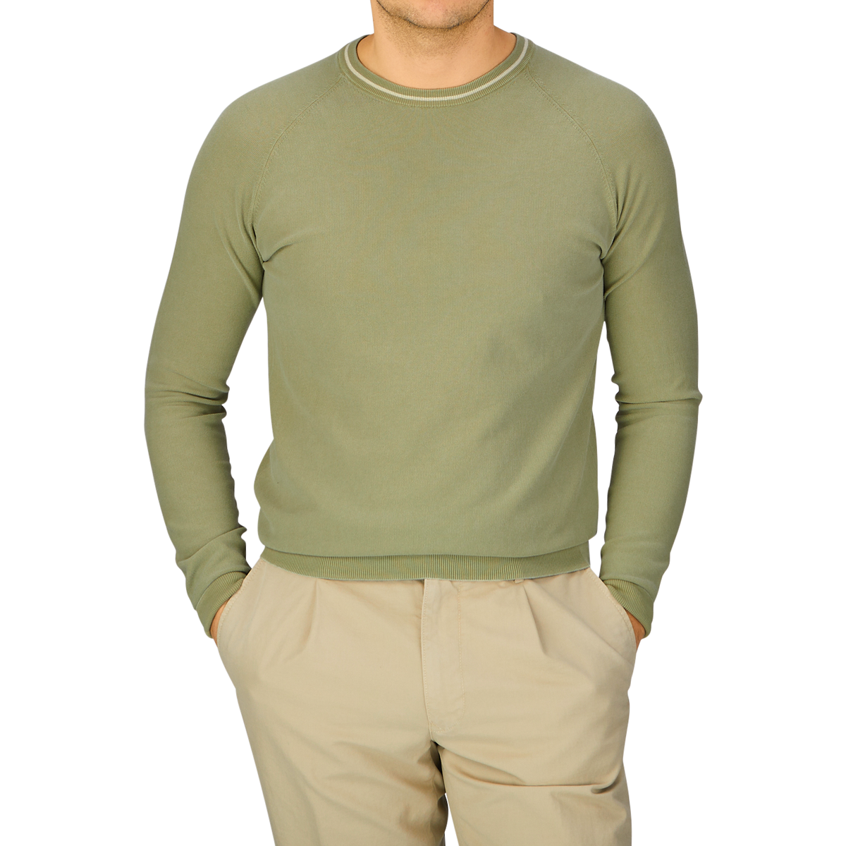 A man wearing an Aspesi Sage Green Cotton Piquet Crew Neck Sweater and khaki pants.