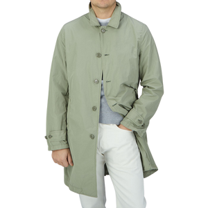 A man wearing an Aspesi Sage Green Micro Nylon Limone Coat.