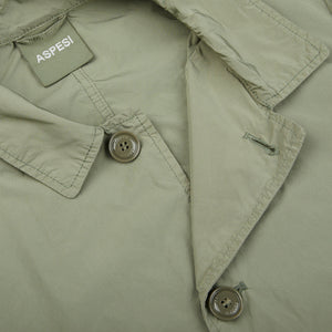 A close up of an Aspesi Sage Green Micro Nylon Limone Coat with buttons.