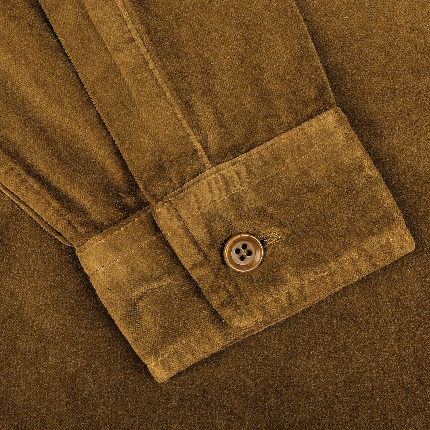 Close-up of the cuff on the Aspesi Tobacco Brown Cotton Velvet Overshirt, showcasing its long-sleeve design with a single button fastening.