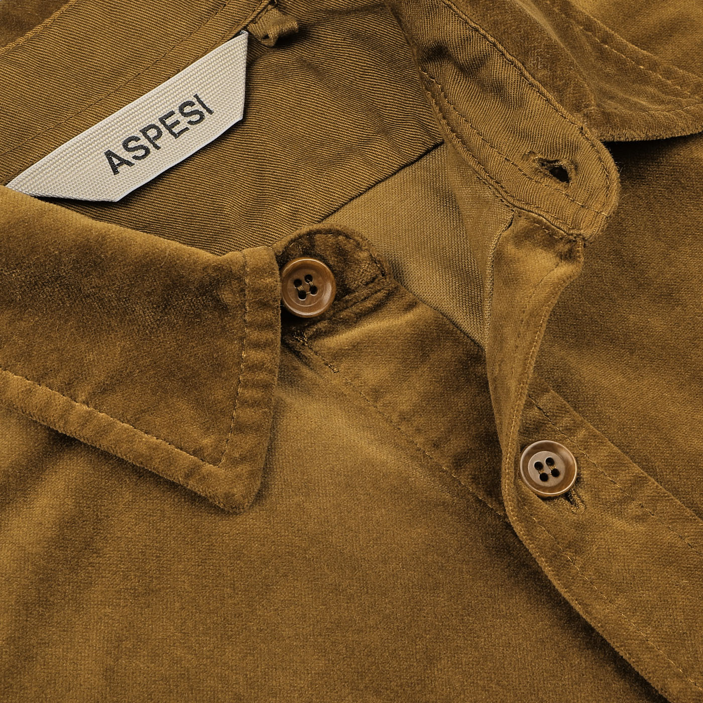 Close-up of the Aspesi Tobacco Brown Cotton Velvet Overshirt, highlighting the collar, buttons, and label.