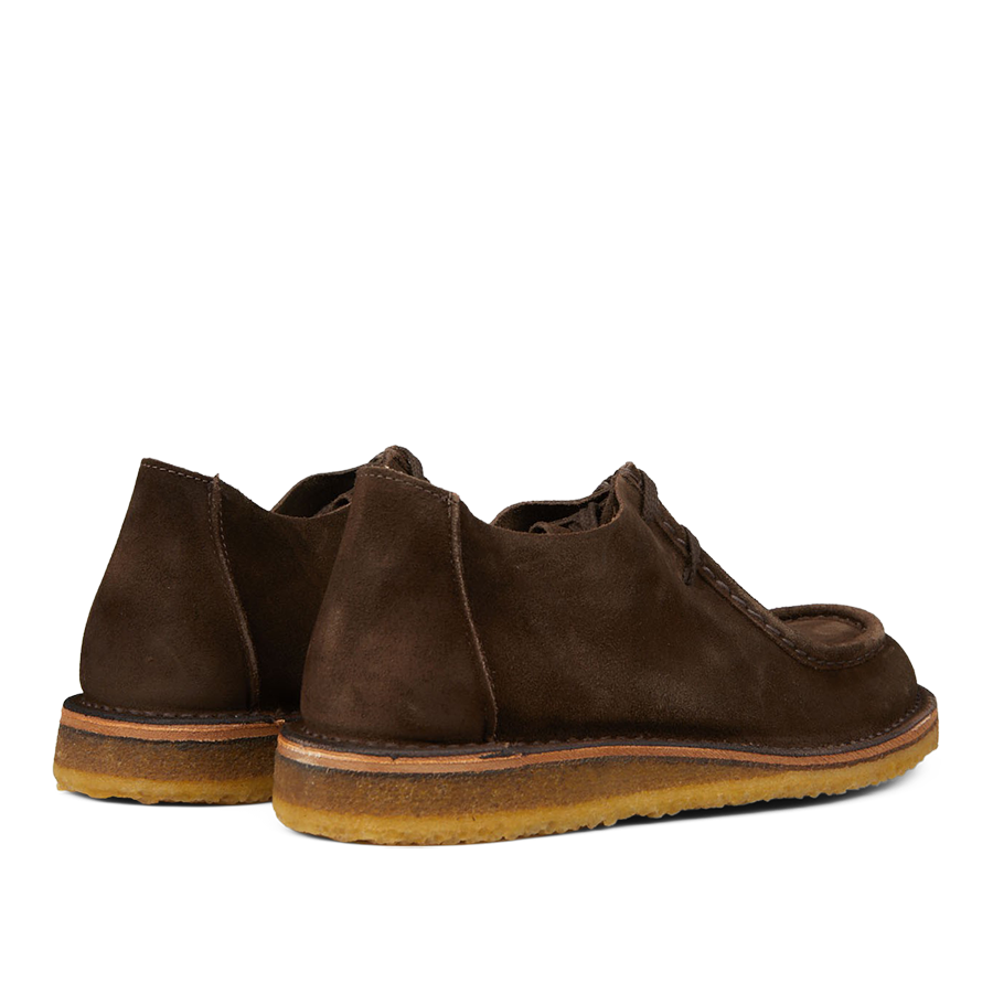 A pair of brown Astorflex suede chukka boots with visible crepe soles.