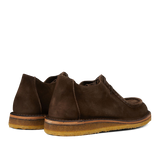 A pair of brown Astorflex suede chukka boots with visible crepe soles.