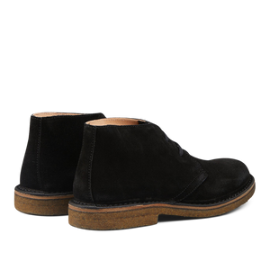 A pair of Black Suede Astorflex desert boots on a white background.