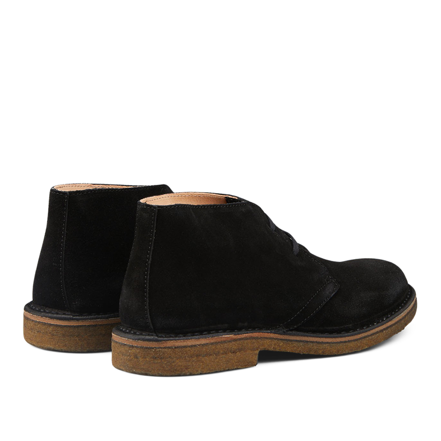 Sentence with product name and brand name: A pair of Astorflex Black Suede Greenflex Desert Boots with rubber soles, displayed on a plain background.