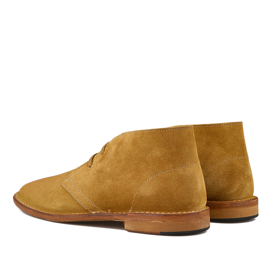 The Cuoio Beige Suede Leather Buffalo Montflex Boots by Astorflex highlight Tuscan tanneries' craftsmanship with visible stitching, brown soles, and a Greenflex desert boot style touch, presenting an elegant rear view.