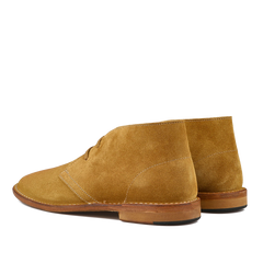 The Cuoio Beige Suede Leather Buffalo Montflex Boots by Astorflex highlight Tuscan tanneries' craftsmanship with visible stitching, brown soles, and a Greenflex desert boot style touch, presenting an elegant rear view.