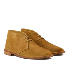 Astorflex's Cuoio Beige Suede Leather Buffalo Montflex Boots, crafted from Tuscan tanneries, showcase tan suede with laces and brown soles, captured beautifully from a side angle.