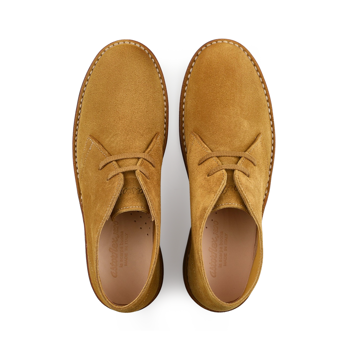 Top view of a pair of Cuoio Beige Suede Leather Buffalo Montflex boots by Astorflex, highlighting the craftsmanship of Tuscan tanneries on a white background.