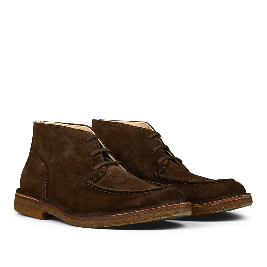 Astorflex's Dark Chestnut Suede Dukeflex Chukka Boots, made from rich vegetable-tanned suede with natural crepe rubber soles, are elegantly displayed on a white background.