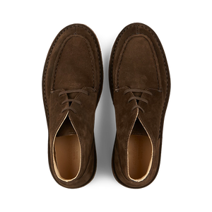 A pair of dark chestnut suede Astorflex Dukeflex Chukka Boots with laces, viewed from above on a plain background.