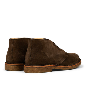 A pair of dark chestnut suede Astorflex Greenflex desert boots with crepe soles.