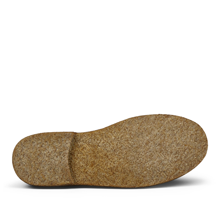 A single vegetable-tanned Dark Chestnut Suede Greenflex Desert Boot insole by Astorflex isolated on a transparent background.