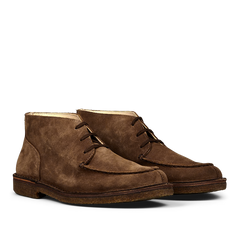 A pair of Dark Khaki Suede Dukeflex Chukka Boots by Astorflex, featuring laces, a textured natural crepe rubber sole, and an ankle-height design, crafted from luxurious vegetable-tanned suede.