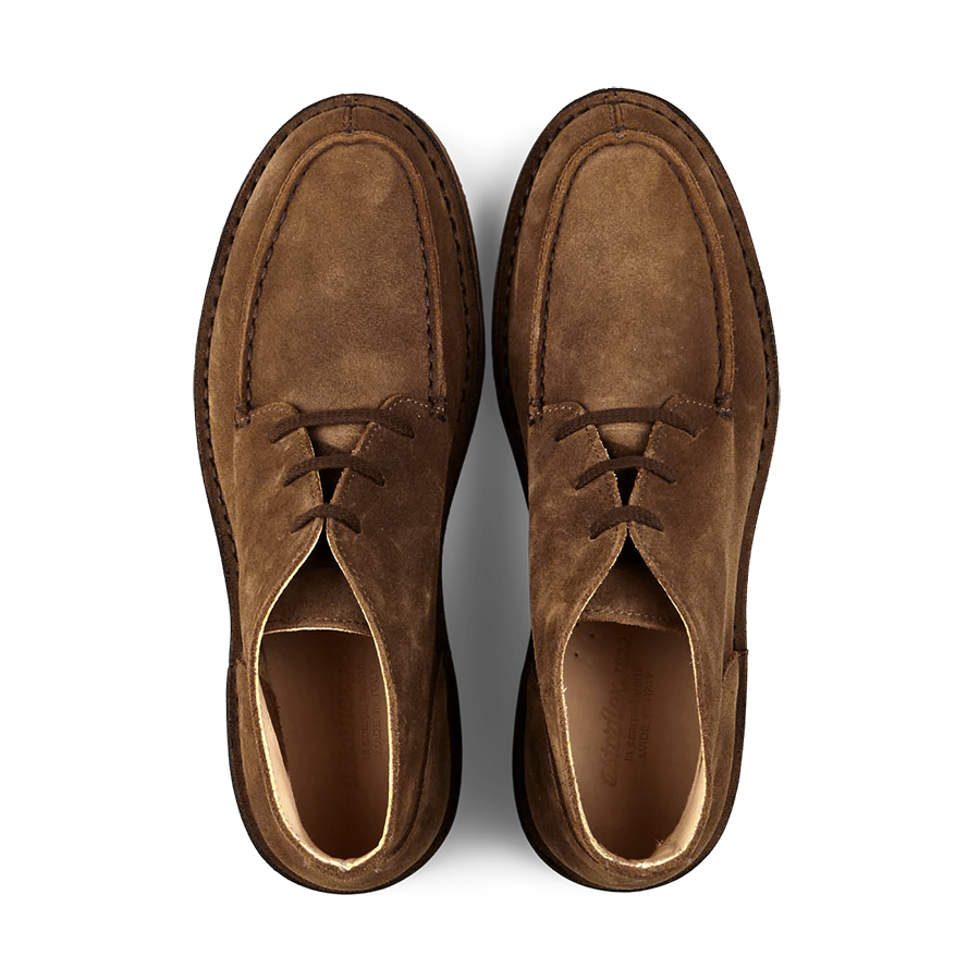 A pair of dark khaki suede chukka boots viewed from above, crafted with durable vegetable-tanned suede and featuring a comfortable Dukeflex insole by Astorflex.