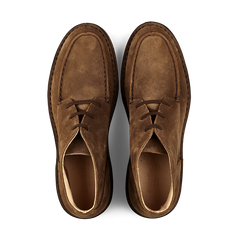 A pair of dark khaki suede chukka boots viewed from above, crafted with durable vegetable-tanned suede and featuring a comfortable Dukeflex insole by Astorflex.