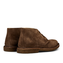 A pair of Astorflex Dark Khaki Suede Greenflex Desert Boots, made from vegetable-tanned suede with a crepe sole, viewed from the back.