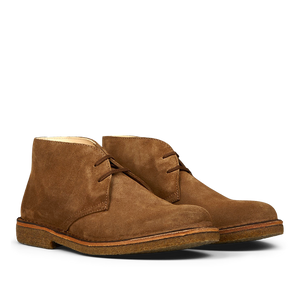 A pair of brown Astorflex desert boots with laces, crafted from vegetable-tanned suede.