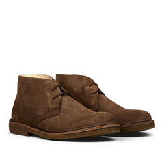 Angle view of Dark Khaki Suede Greenflex Desert Boots by Astorflex, featuring a low, flat sole and laces.