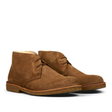 A pair of brown Astorflex desert boots with laces, crafted from vegetable-tanned suede.