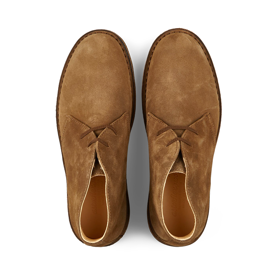 A pair of Astorflex Dark Khaki Suede Greenflex desert boots with laces on a white background.