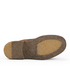 The image shows the sole of a Dark Khaki Suede Leather Nuvoflex Boot by Astorflex, crafted from natural crepe rubber and marked by a textured, tan-colored surface with visible heel and ball sections.