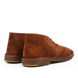 A pair of Mattone Brown Suede Leather Montflex Boots by Astorflex crafted from premium suede, featuring crepe soles, viewed from the back and slightly to the side.