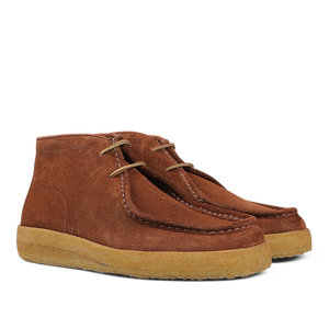 A pair of Astorflex Mattone Brown Suede Rampiflex boots crafted from vegetable-tanned suede, featuring beige natural crepe rubber soles and lace-up closures.