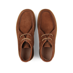 Astorflex's Mattone Brown Suede Rampiflex Boots are crafted from vegetable-tanned suede and feature two eyelets paired with beige laces, along with a natural crepe rubber sole for enhanced comfort and style.