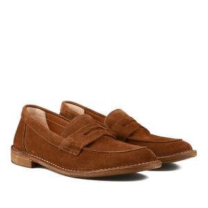 The Mattone Suede Leather Buffalo Sadelflex Loafers by Astorflex are crafted from vegetable-tanned suede leather with a penny slot design, featuring visible stitching and light brown soles.