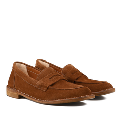 The Mattone Suede Leather Buffalo Sadelflex Loafers by Astorflex are crafted from vegetable-tanned suede leather with a penny slot design, featuring visible stitching and light brown soles.