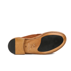 The image features the sole of Mattone Suede Leather Buffalo Sadelflex Loafers by Astorflex, showcasing a brown leather design with a dark rubber heel and forepart for enhanced comfort using Sadelflex technology.