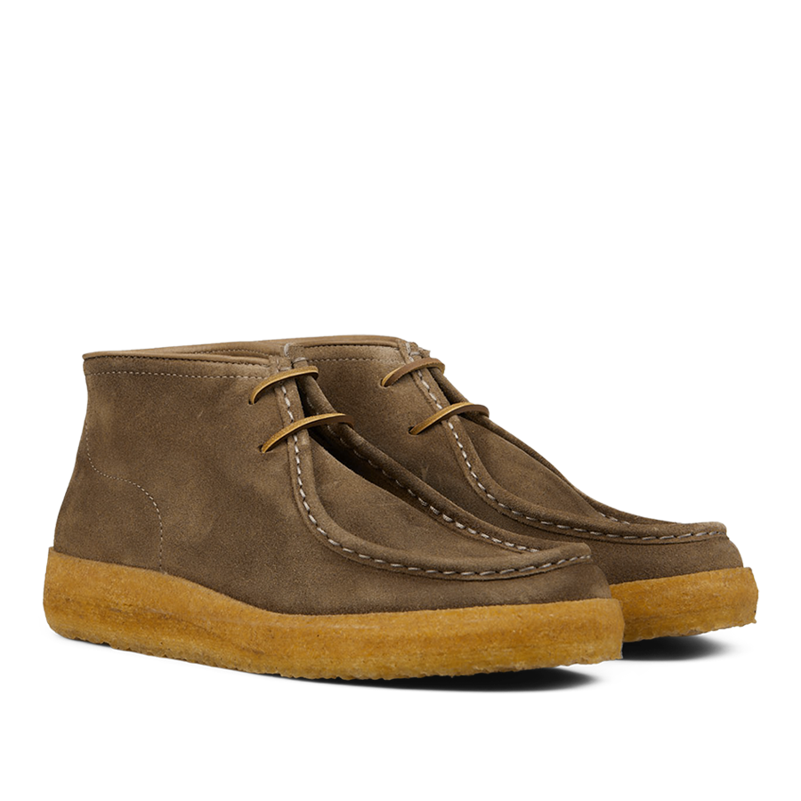 A pair of brown, vegetable-tanned Fumo Green Suede Rampiflex boots with crepe rubber soles by Astorflex.