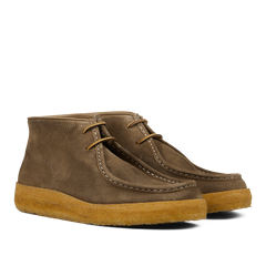 A pair of brown, vegetable-tanned Fumo Green Suede Rampiflex boots with crepe rubber soles by Astorflex.