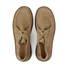 A pair of stone beige suede Astorflex moccasins viewed from above.