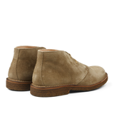 A pair of Astorflex Stone Beige Suede Greenflex Desert Boots with rubber soles displayed against a neutral background.