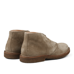 A rear view of the Stone Beige Suede Greenflex Desert Boots by Astorflex, featuring vegetable-tanned suede in beige and brown crepe rubber soles.