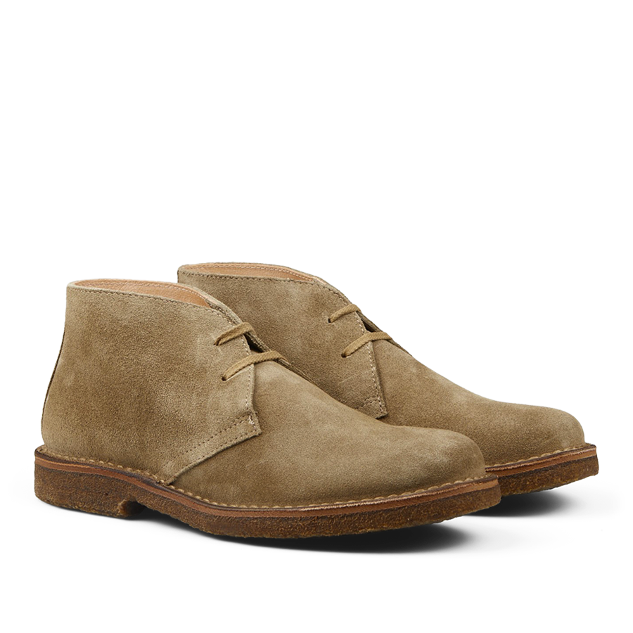 A pair of Stone Beige Suede Greenflex desert boots with laces on a neutral background.