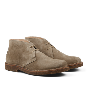 A pair of Stone Beige Suede Greenflex Desert Boots by Astorflex, featuring a minimalist lace-up design and brown crepe soles.